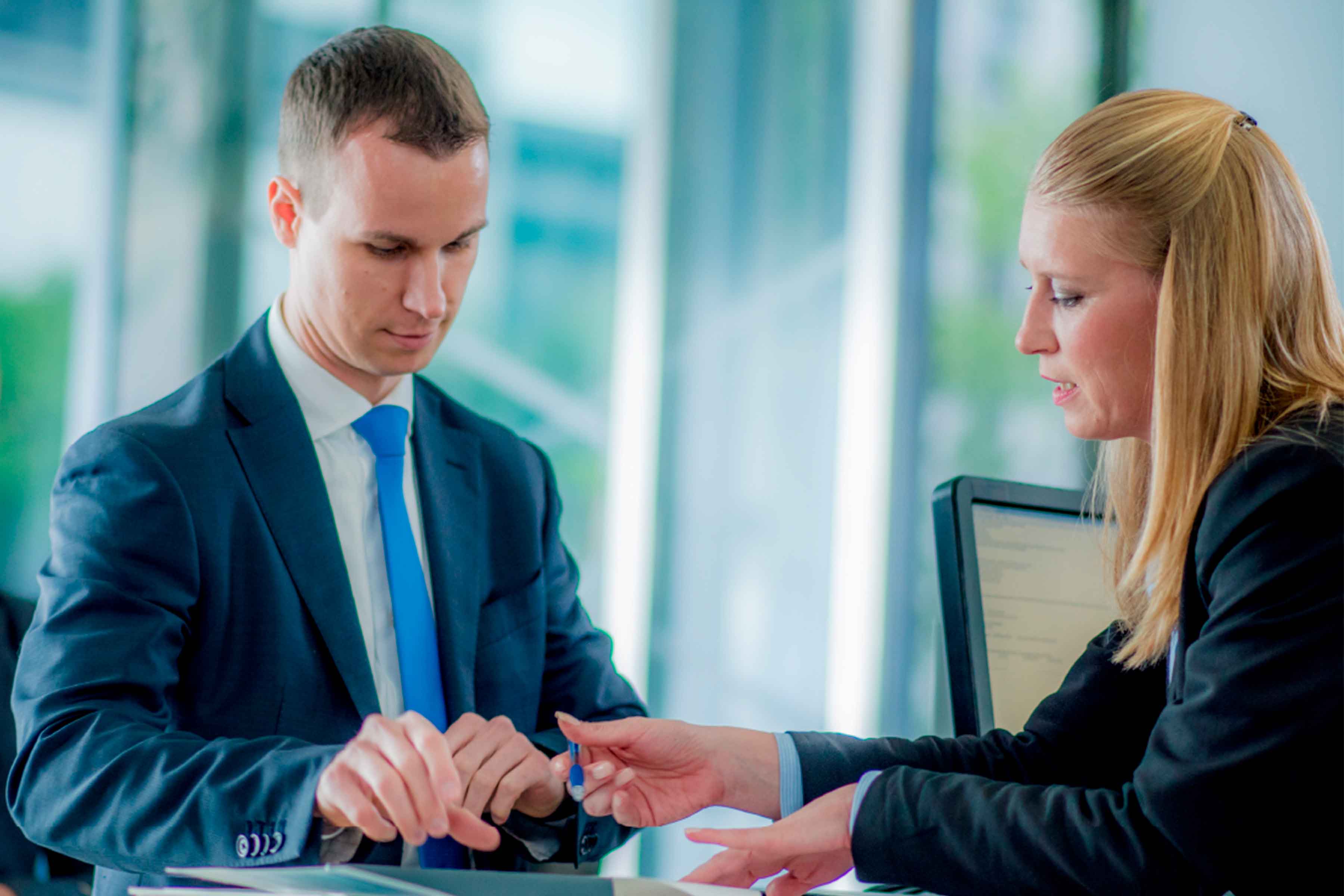 Man and woman collaborating in a bank