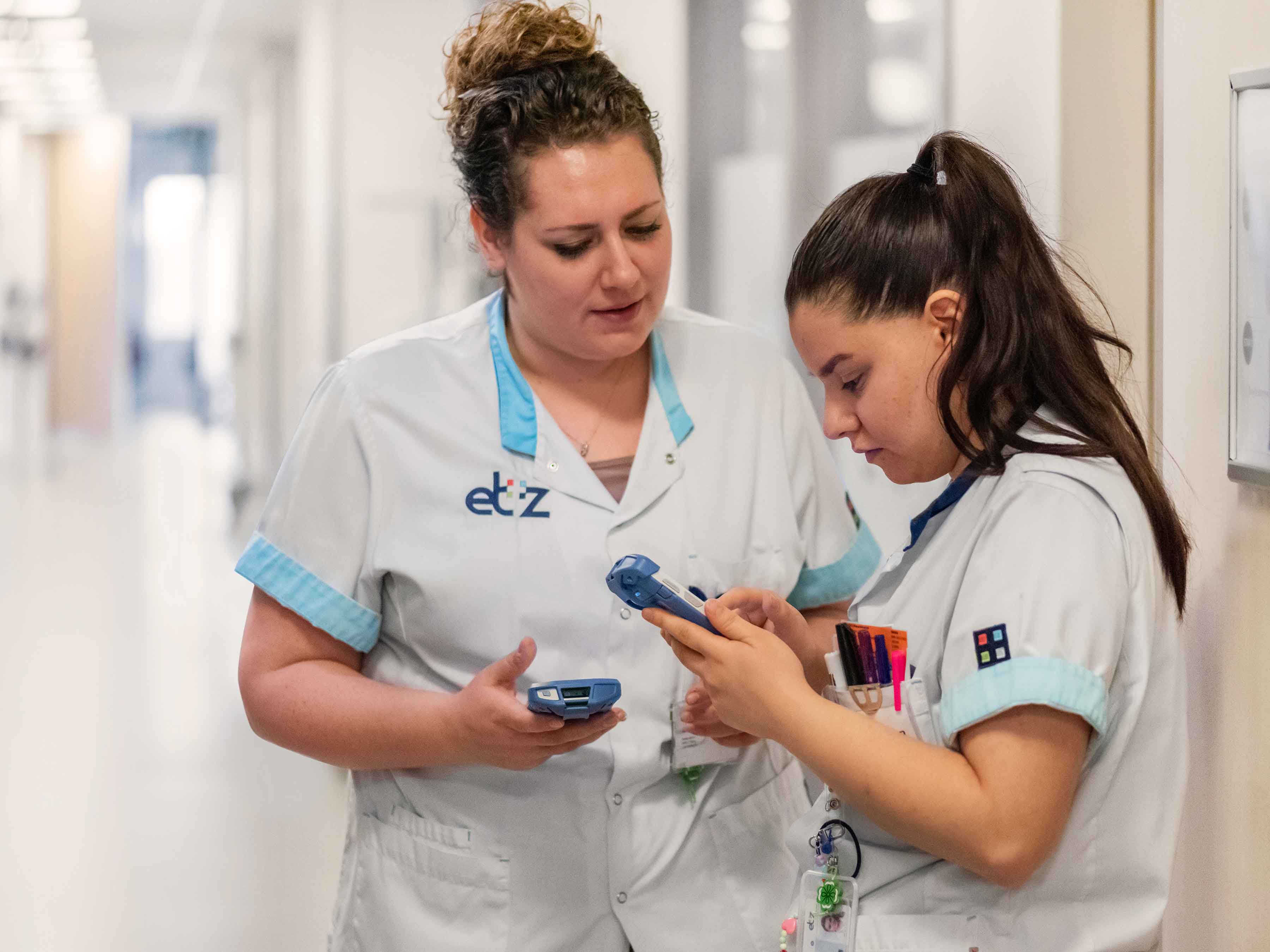 Healthcare Nurses Interacting in Hallway with TC52-HC 4:3